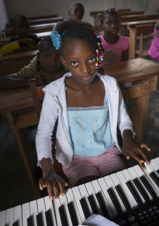 Girl Playing Music In A School, Inhambane, Inhambane Province, Mozambique