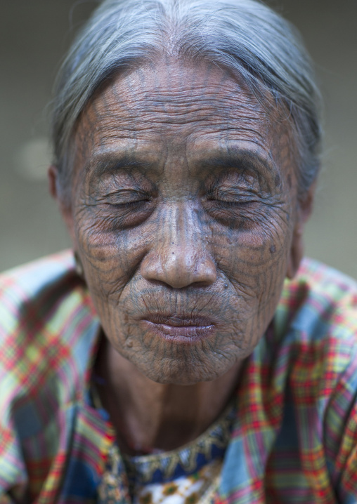Tribal Chin Woman With Spiderweb Tattoo On The Face And Closed Eyes, Mrauk U, Myanmar