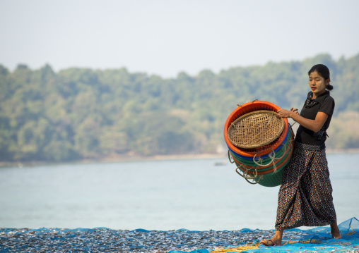 Woman Putting Dried Fish On The Floor, Ngapali, Myanmar