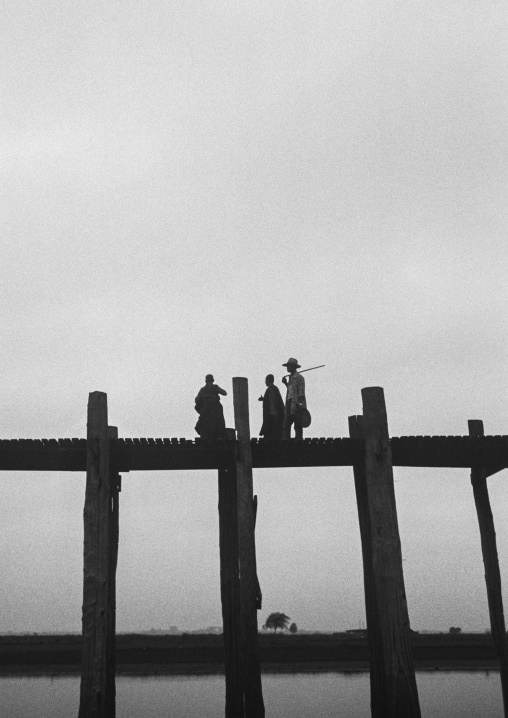 People Crossing U Bein Bridge In Amarapura, Mandalay, Myanmar