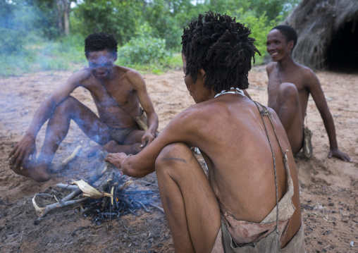 Bushman People Around A Fire In A Traditional Village, Tsumkwe, Namibia