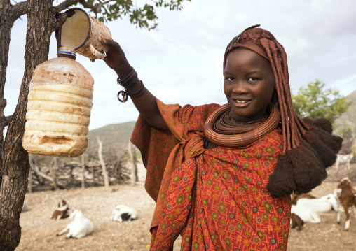 Himba Woman Collecting Milk, Epupa, Namibia