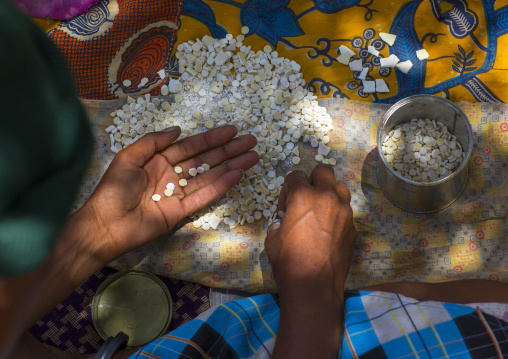 Bushman Woman Making Necklaces With Ostrich Eggs Shells, Tsumkwe, Namibia