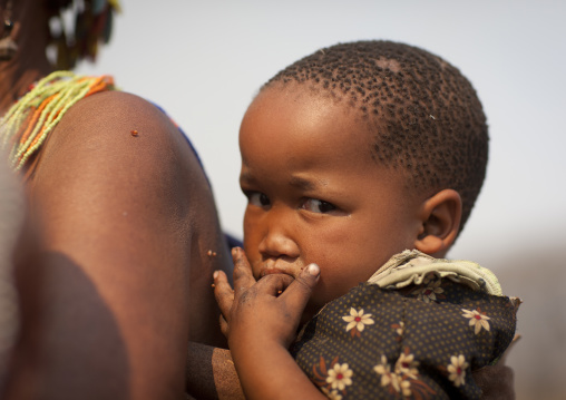 San Baby On The Back Of His Mother, Namibia