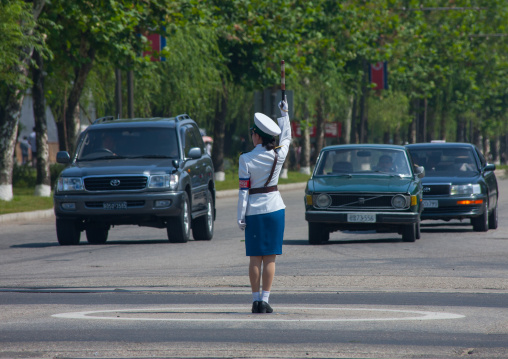 North Korean female traffic security officer in white uniform in the street, Pyongan Province, Pyongyang, North Korea