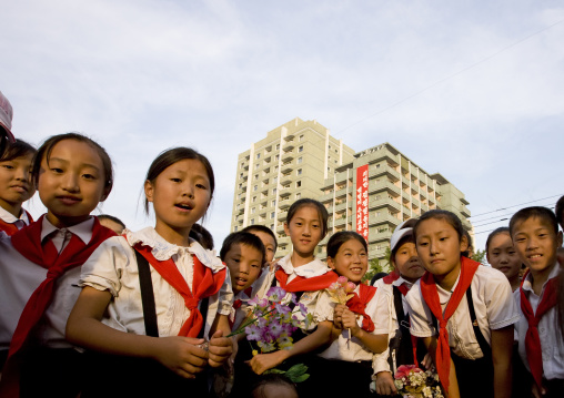Smiling and laughing group of North Korean pioneers in town, Pyongan Province, Pyongyang, North Korea