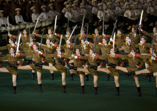 Sexy North Korean women dressed as soldiers dancing with swords during the Arirang mass games in may day stadium, Pyongan Province, Pyongyang, North Korea