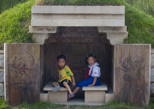 North Korean children sit on a bench in a park, North Hwanghae Province, Sariwon, North Korea