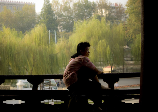 North Korean woman having a rest in a park, North Hwanghae Province, Sariwon, North Korea