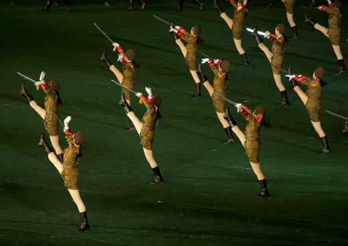 Sexy North Korean women dressed as soldiers dancing with swords during the Arirang mass games in may day stadium, Pyongan Province, Pyongyang, North Korea