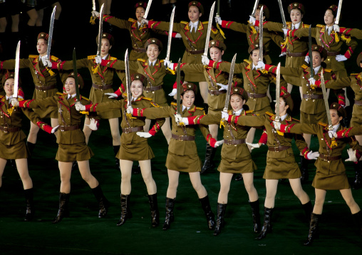 Sexy North Korean women dressed as soldiers dancing with swords during the Arirang mass games in may day stadium, Pyongan Province, Pyongyang, North Korea