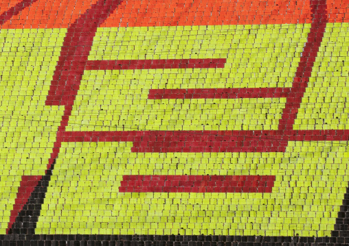 Korean letters made by children pixels holding up colored boards during Arirang mass games in may day stadium, Pyongan Province, Pyongyang, North Korea