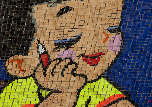 North Korean pupil with a pen made by human pixels holding up colored boards during Arirang mass games in may day stadium, Pyongan Province, Pyongyang, North Korea