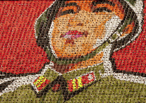 North Korean soldier made by children pixels holding up colored boards during Arirang mass games in may day stadium, Pyongan Province, Pyongyang, North Korea