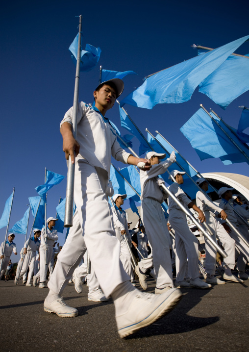 North Korean gymnasts with blue flags during the Arirang mass games in may day stadium, Pyongan Province, Pyongyang, North Korea
