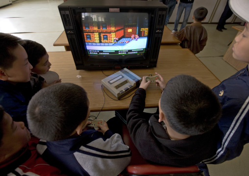 North Korean children playing video games in Songdowon international children's camp, Kangwon Province, Wonsan, North Korea
