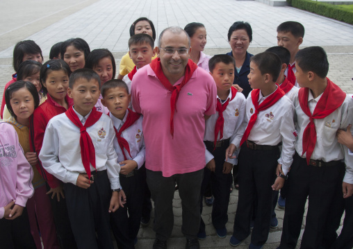 French tourist with North Korean pioneers in Songdowon international children's union camp, Kangwon Province, Wonsan, North Korea