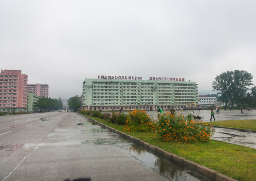 Building with a propaganda slogan on the top in the countryside, South Hamgyong Province, Hamhung, North Korea