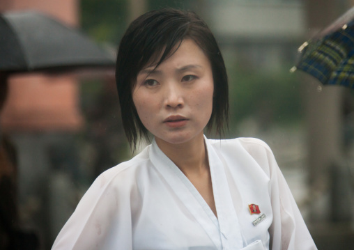 Portrait of a North Korean woman under the rain, South Hamgyong Province, Hamhung, North Korea