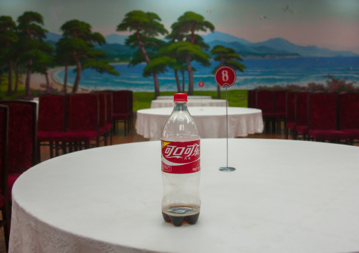 Chinese coca cola bottle on the table of an empty restaurant, South Hamgyong Province, Hamhung, North Korea