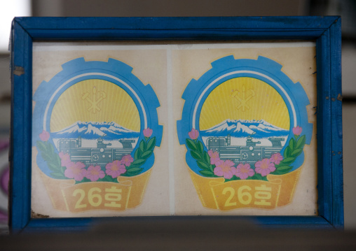 Awards medals given to a tractor in a farm, South Hamgyong Province, Hamhung, North Korea