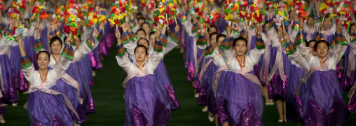 North Korean women dancing in choson-ot during the Arirang mass games in may day stadium, Pyongan Province, Pyongyang, North Korea