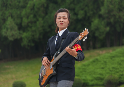 North Korean state artist playing bass on national day, Pyongan Province, Pyongyang, North Korea