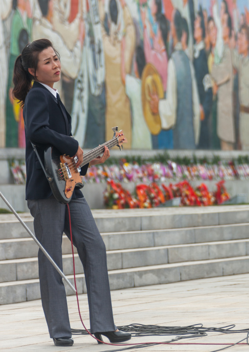 North Korean state artist playing bass on national day, Pyongan Province, Pyongyang, North Korea