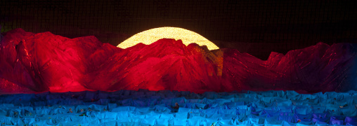 North Korean dancers in front of mount Paektu made by children holding up boards during Arirang in may day stadium, Pyongan Province, Pyongyang, North Korea