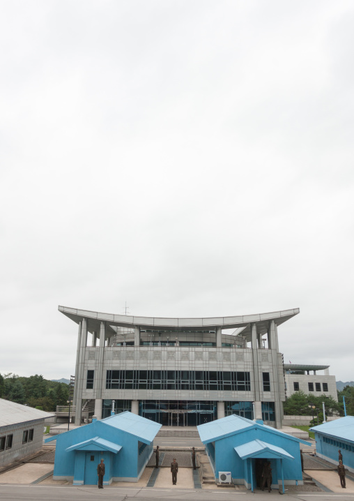 North Korean soldiers standing in front of the United Nations conference rooms on the demarcation line in the Demilitarized Zone, North Hwanghae Province, Panmunjom, North Korea