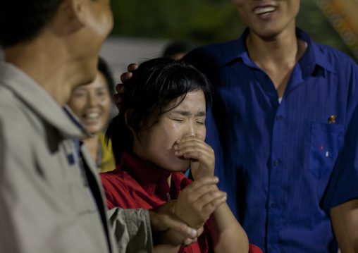 North Korean woman having nausea after a ride at Kaeson youth park fun fair, Pyongan Province, Pyongyang, North Korea
