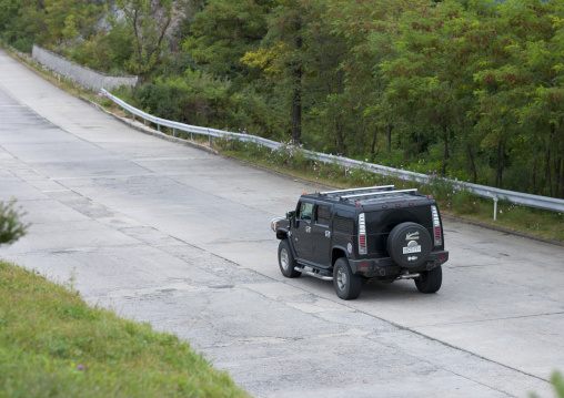Hummer car on a road, Kangwon Province, Wonsan, North Korea