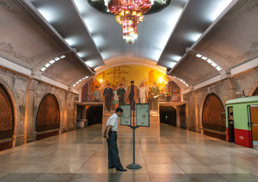 North Korean people reading the offical state newspaper in puhung station on Chollima line, Pyongan Province, Pyongyang, North Korea
