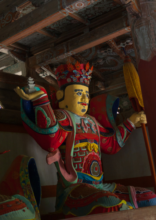Colorful statue of damun-cheonwang heavenly king of the North at the Pohyon-sa Korean buddhist temple, North Pyongan Province, Myohyang-san, North Korea