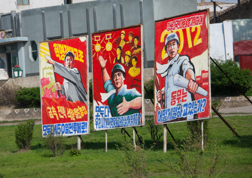 Row of North Korean propaganda billboards in the street, Pyongan Province, Pyongyang, North Korea
