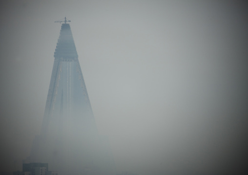 The pyramid-shaped Ryugyong hotel in the fog, Pyongan Province, Pyongyang, North Korea