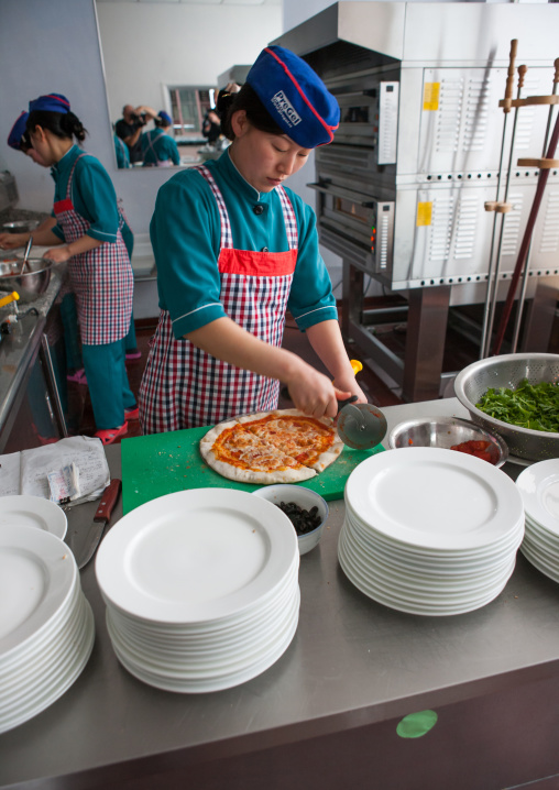 North Korean pizzeria cook in an italian restaurant, Pyongan Province, Pyongyang, North Korea