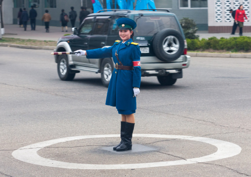 North Korean traffic security officer in blue uniform in the street, Pyongan Province, Pyongyang, North Korea