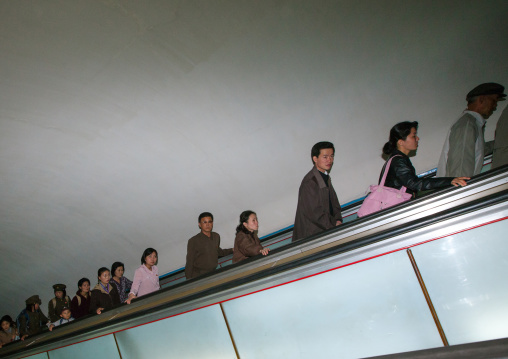 North Korean people using escalator leading to the subway station, Pyongan Province, Pyongyang, North Korea