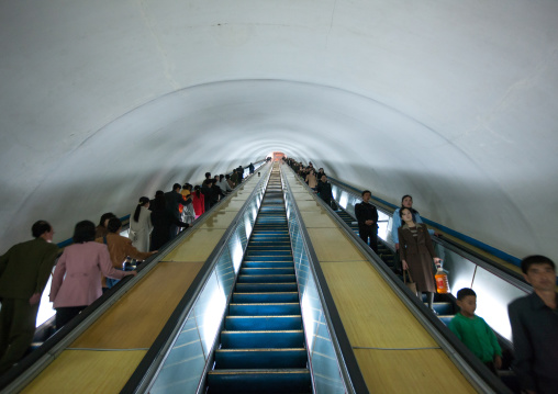 North Korean people using escalator leading to the subway station, Pyongan Province, Pyongyang, North Korea