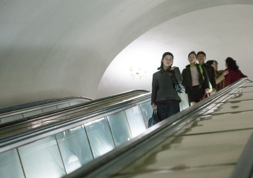 North Korean people using escalator leading to the subway station, Pyongan Province, Pyongyang, North Korea