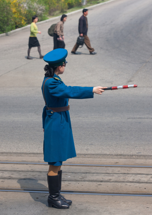 North Korean traffic security officer in blue uniform in the street, Pyongan Province, Pyongyang, North Korea