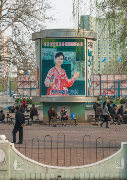 North Korean propaganda billboard on a square with the slogan let's actively promote the good morals of our people, Pyongan Province, Pyongyang, North Korea