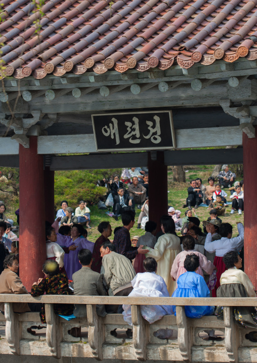 North Korean people dancing in a pavillon for the day of the sun which is the birth anniversary of Kim Il-sung, Pyongan Province, Pyongyang, North Korea