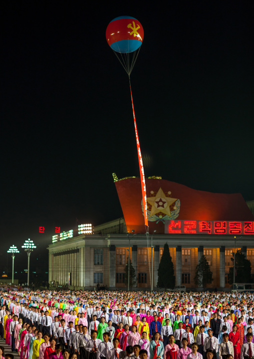 North Korean students dancing to celebrate april 15 the birth anniversary of Kim Il-sung on Kim il Sung square, Pyongan Province, Pyongyang, North Korea