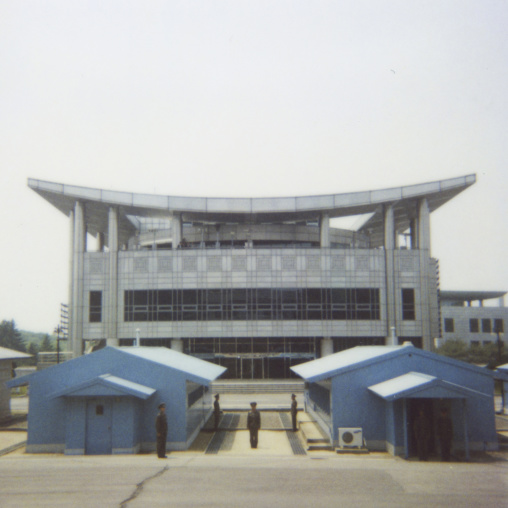 Polaroid of North Korean soldiers standing in front of the United Nations conference rooms on the demarcation line in the Demilitarized Zone, North Hwanghae Province, Panmunjom, North Korea