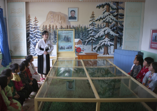 North Korean children in a primary school learning the life of Kim Jong-il, South Pyongan Province, Chongsan-ri Cooperative Farm, North Korea