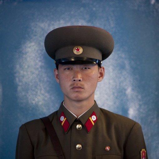 North Korean soldier standing in front of the United Nations conference rooms on the demarcation line in the Demilitarized Zone, North Hwanghae Province, Panmunjom, North Korea