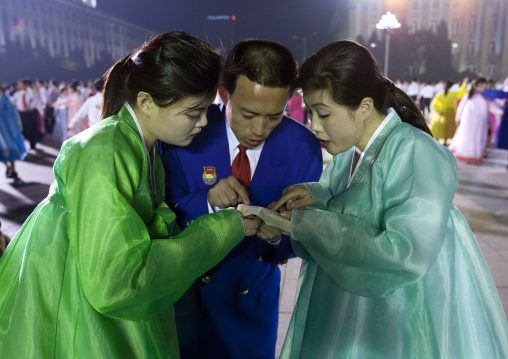 North Korean students dancing to celebrate april 15 the birth anniversary of Kim Il-sung on Kim il Sung square, Pyongan Province, Pyongyang, North Korea