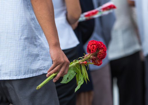 North Korean people bringing flowers to pay respect to the Leaders in Mansudae art studio, Pyongan Province, Pyongyang, North Korea